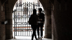 students walking through the gate