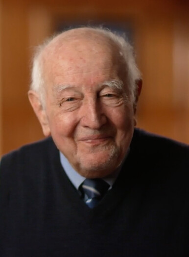 Guido Calabresi smiles with a soft focus background 