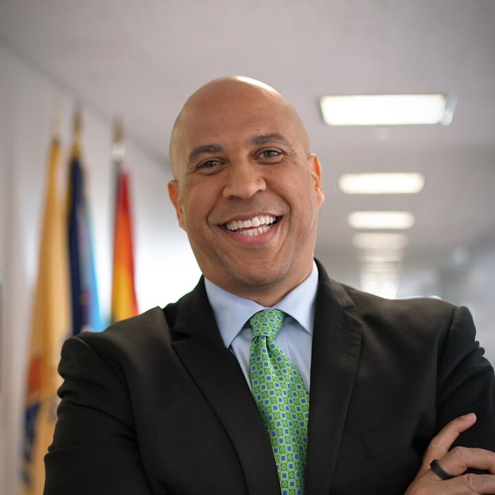 Corey Booker smiling in an office hallway