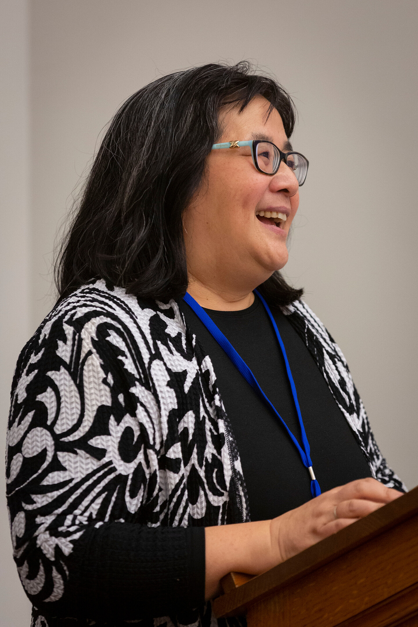 Jean Koh Peters smiling at a lectern